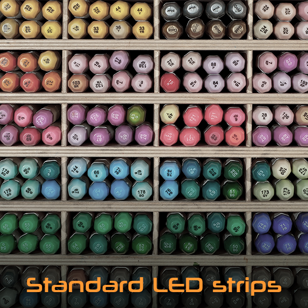 Image of a shelf with colorful markers appearing dull due to low CRI. A caption on the bottom reads "Standard LED strips."